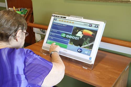 BrainTrainerPlus software shown on the touchscreen console